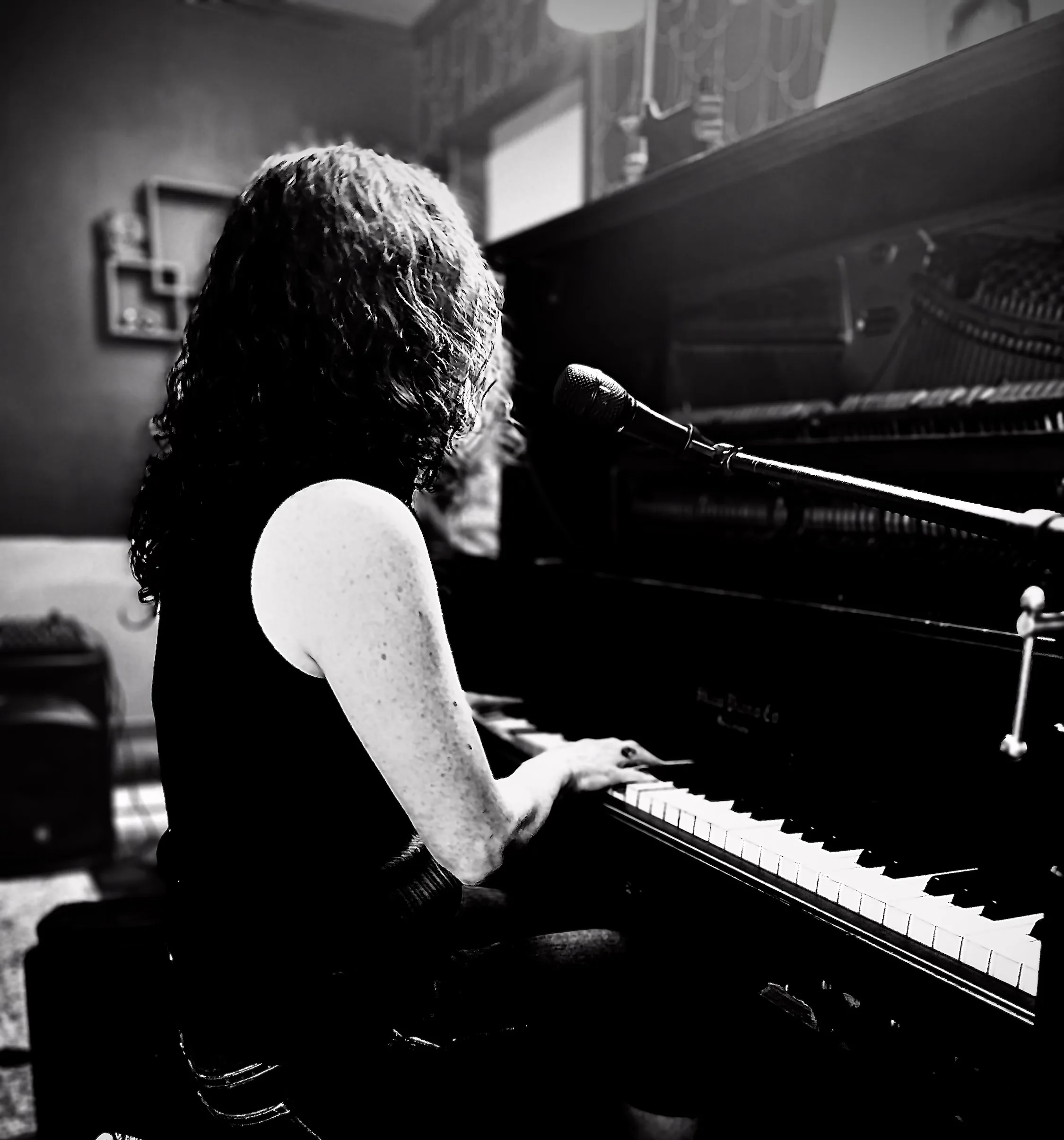 A. Rheannon Spaulding playing the piano